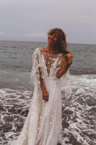 Vestidos de novia bohemios de corte A, manga larga, espalda descubierta y encaje.