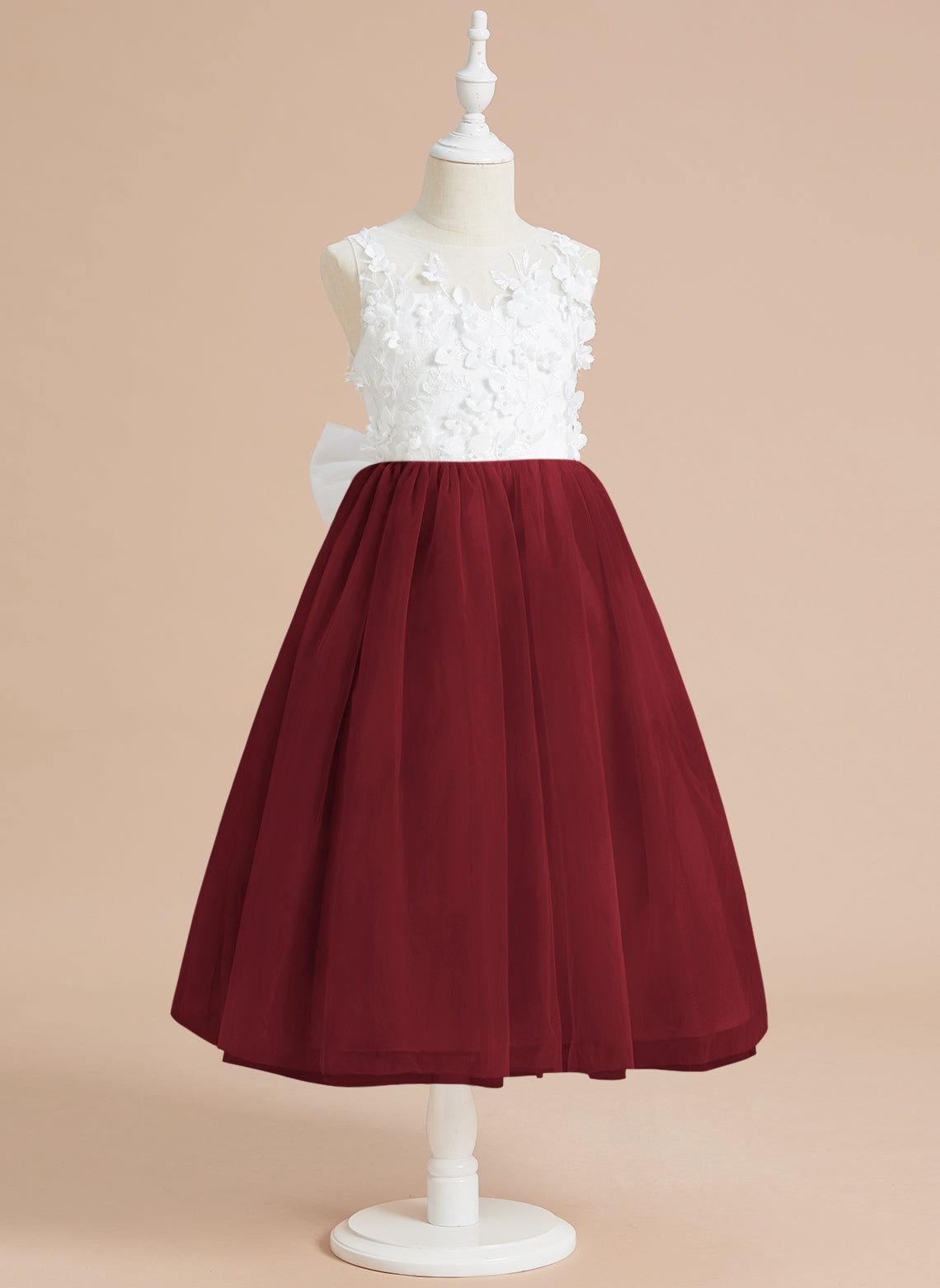 Vestido midi de encaje floral y lazo grande 