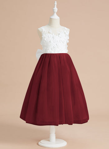 Vestido midi de encaje floral y lazo grande 