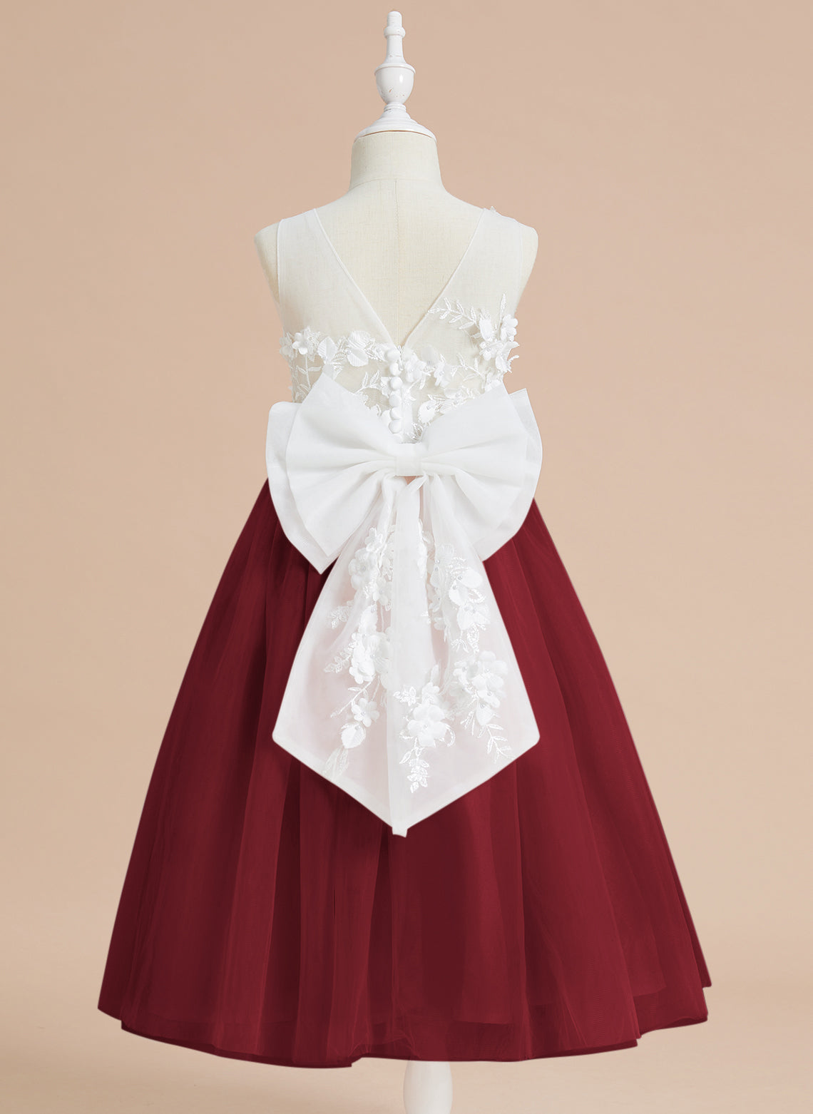 Vestido midi de encaje floral y lazo grande 