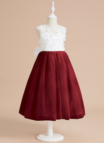 Vestido midi de encaje floral y lazo grande 