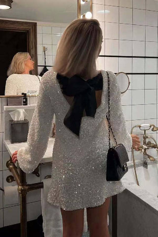 Robe mini ample à paillettes et nœud dans le dos, idéale pour danser toute la nuit 