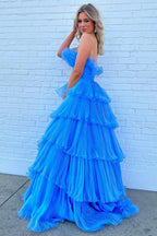 Charmante robe de bal longue bleue bustier trapèze à volants