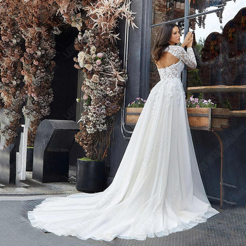 Vestido de novia corte A, manga larga desmontable, elegante, espalda descubierta, encaje, apliques de tul. 