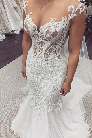 Vestido de novia de sirena con encaje y mangas cortas