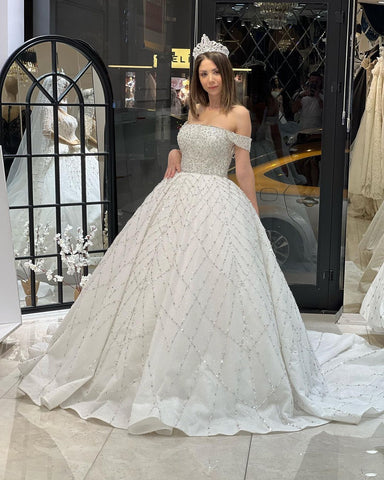 Encantador vestido de novia largo hasta el suelo, corte en A, con lentejuelas y hombros descubiertos, con cola de corte.