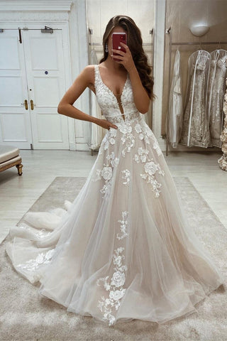 Elegante vestido de novia largo sin mangas con escote en V, corte en A, apliques de encaje y escote en V.