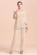 Elegante mono de gasa color champán con cuello redondo para la madre de la novia disponible online