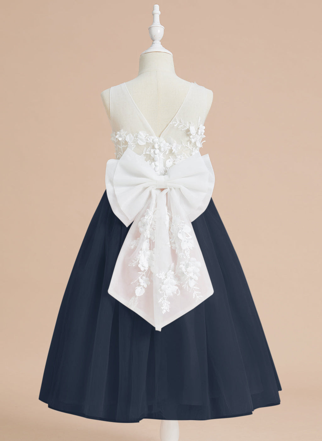 Vestido midi de encaje floral y lazo grande 