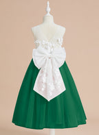 Vestido midi de encaje floral y lazo grande 