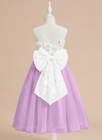 Vestido midi de encaje floral y lazo grande 