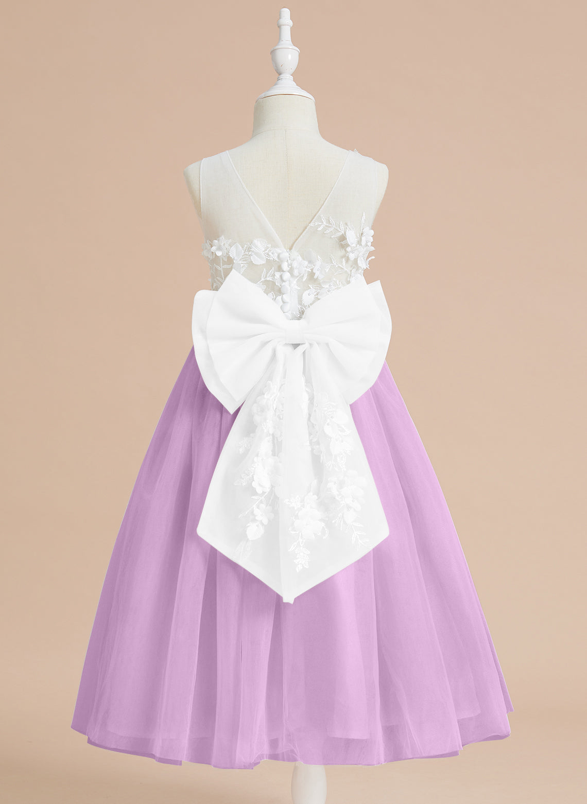 Vestido midi de encaje floral y lazo grande 