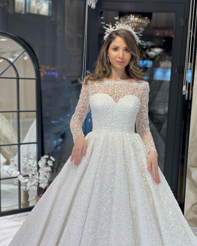 Vestido de novia de encaje de corte A, largo hasta el suelo, de lujo, con mangas largas y volantes.