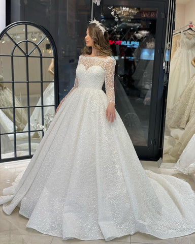Vestido de novia de encaje de corte A, largo hasta el suelo, de lujo, con mangas largas y volantes.