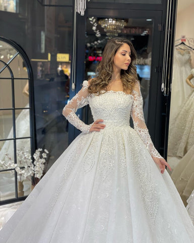 Vestido de novia de encaje de corte A, largo hasta el suelo, de lujo, con mangas largas y volantes.