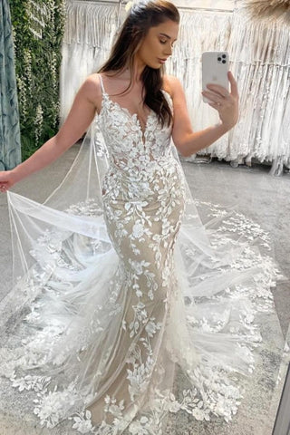 Vestidos de novia color marfil, sin mangas, de encaje, con tirantes finos, apliques y cola, de diseño elegante.