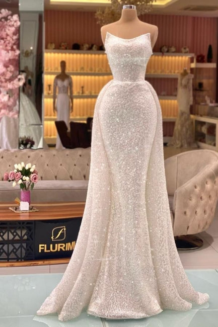 Robe de bal sirène longue ivoire sans bretelles avec paillettes, de créateur