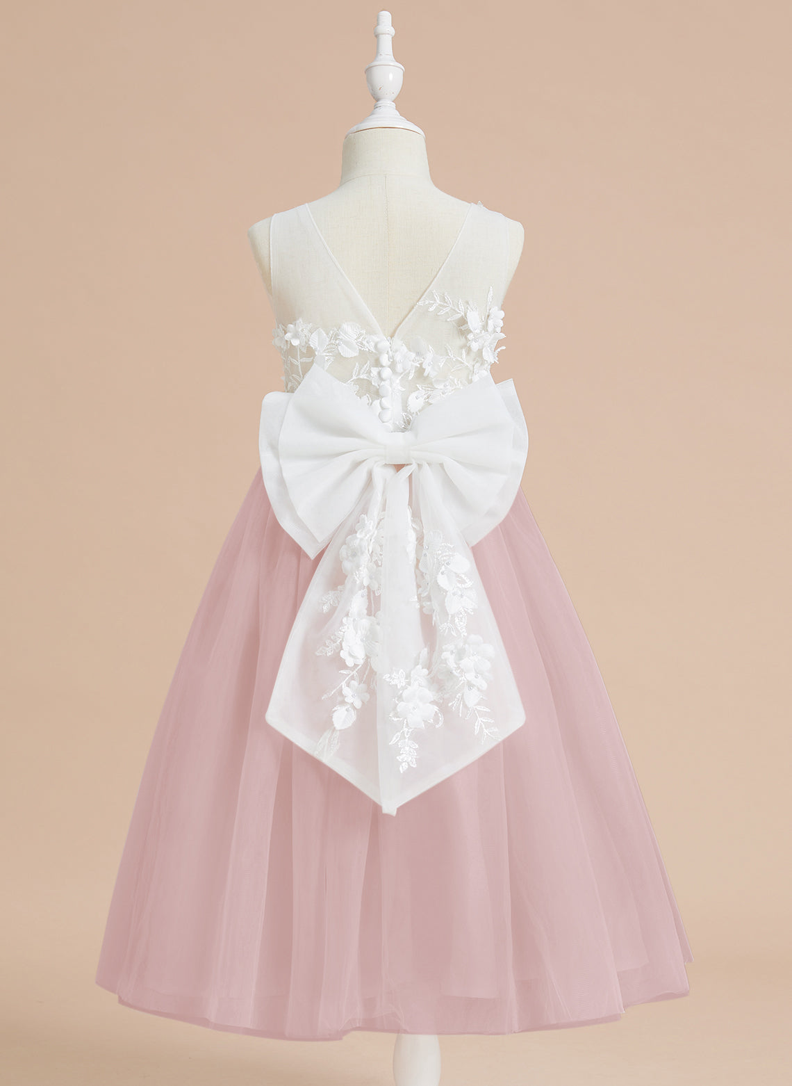 Vestido midi de encaje floral y lazo grande 