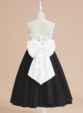 Vestido midi de encaje floral y lazo grande 