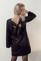Robe mini ample à sequins et nœud papillon dans le dos, inspirée par Lost in Your Eyes 