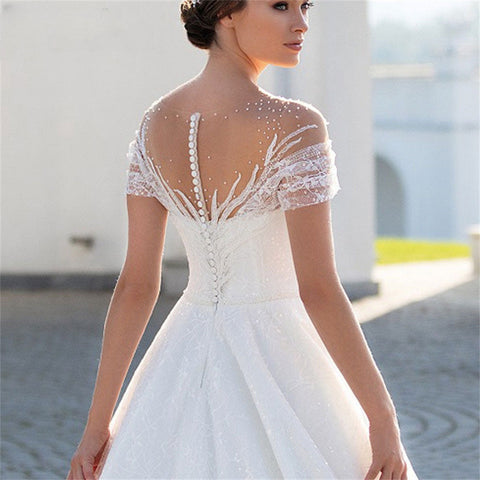 Robes de mariée charmantes à manches courtes 2024, robe de mariée classique en dentelle, coupe trapèze, dos nu, col rond, sur mesure 