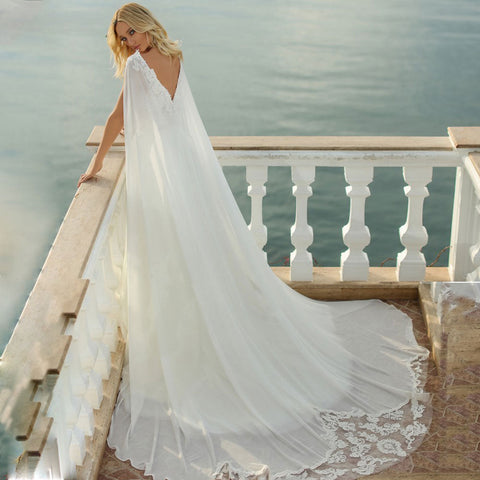 Vestido de novia con tirantes finos, elegantes apliques de encaje, escote en V, espalda descubierta, de gasa, hecho a medida. 