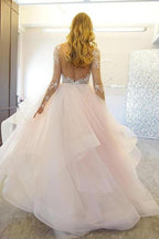 Robe de mariée élégante en tulle à manches longues et coupe trapèze, ornée d'appliqués WD036