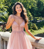 Robe de bal longue en tulle élégante, coupe trapèze, col en V, ornée de perles et dos nu.