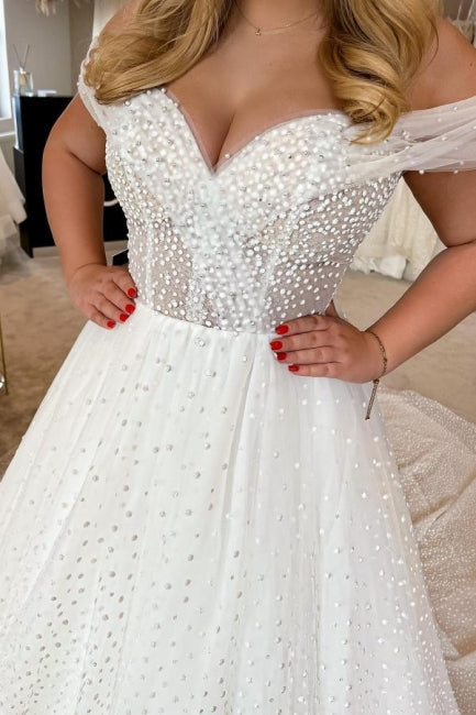 Elegante vestido de novia blanco de corte A, sin mangas, con hombros descubiertos y perlas