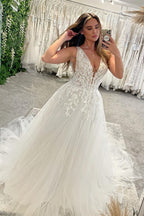 Robe de mariée élégante en tulle, coupe trapèze, col en V, sans manches, longueur au sol, ornée d'appliqués