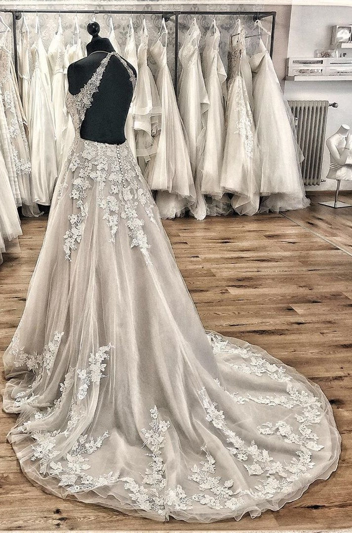 Elegante vestido de novia largo de corte A, escote halter, espalda descubierta, apliques, encaje, tul, volantes y cola