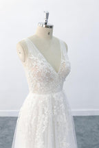 Elegante vestido de novia largo de corte A con escote en V, apliques, tul y espalda descubierta