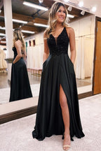 Elegante vestido de noche largo negro de corte A con escote en V, lentejuelas y brillo.
