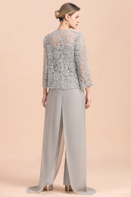 Combinaison élégante en mousseline de soie avec haut en dentelle argentée et paréo, idéale pour la mère de la mariée (disponible en ligne).