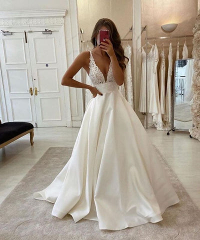 Elegantes vestidos de novia sin mangas, de tul, con espalda descubierta y corte en A, con encaje. 