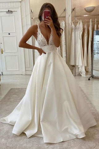 Elegantes vestidos de novia sin mangas, de tul, con espalda descubierta y corte en A, con encaje. 