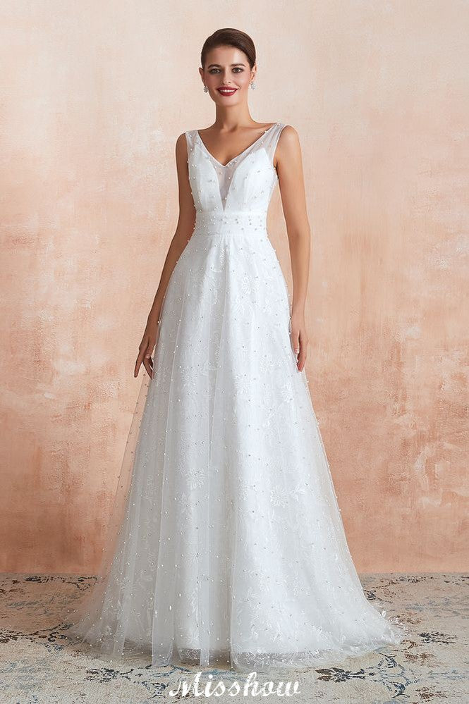Robe de mariée élégante en tulle et perles, col en V, idéale pour la plage