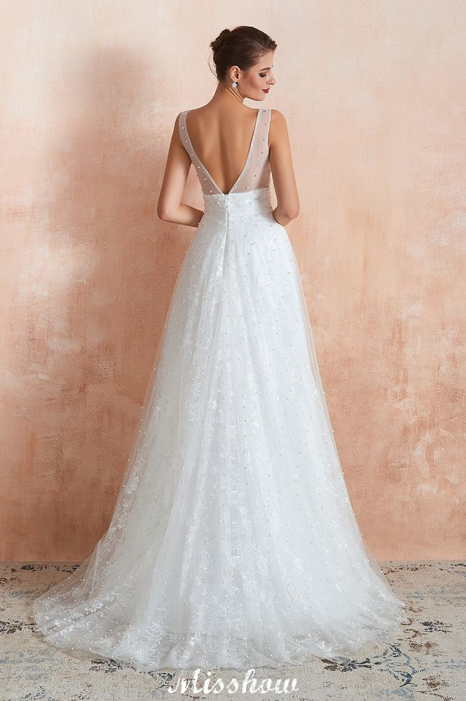 Robe de mariée élégante en tulle et perles, col en V, idéale pour la plage