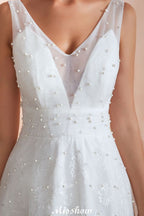 Robe de mariée élégante en tulle et perles, col en V, idéale pour la plage