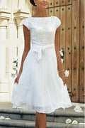 Robe de mariée élégante en mousseline blanche, coupe trapèze, manches courtes