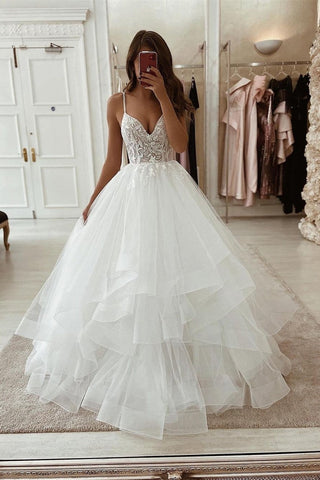 Elegante vestido de novia blanco de corte A, sin mangas, con escote en V, de tul y encaje.