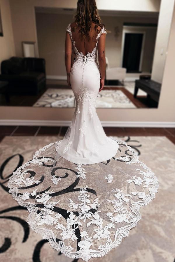 Robe de mariée sirène longue élégante, décolleté cœur, sans manches, traîne chapelle et dos nu