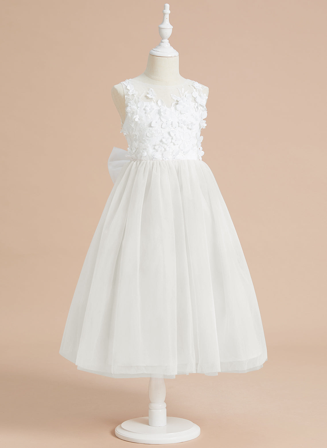 Vestido midi de encaje floral y lazo grande 