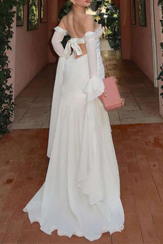 Vestidos de noche formales y elegantes sin tirantes con flores de frenillo. 