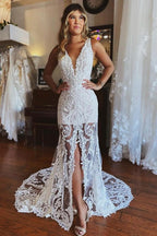 Robe de mariée sirène en dentelle à fines bretelles et fente
