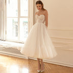Robe de mariée romantique bustier sans manches, coupe trapèze, dos nu court, robe de soirée élégante en tulle avec nœud. 