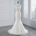 Glamuroso vestido de novia largo de sirena con apliques de tul y encaje
