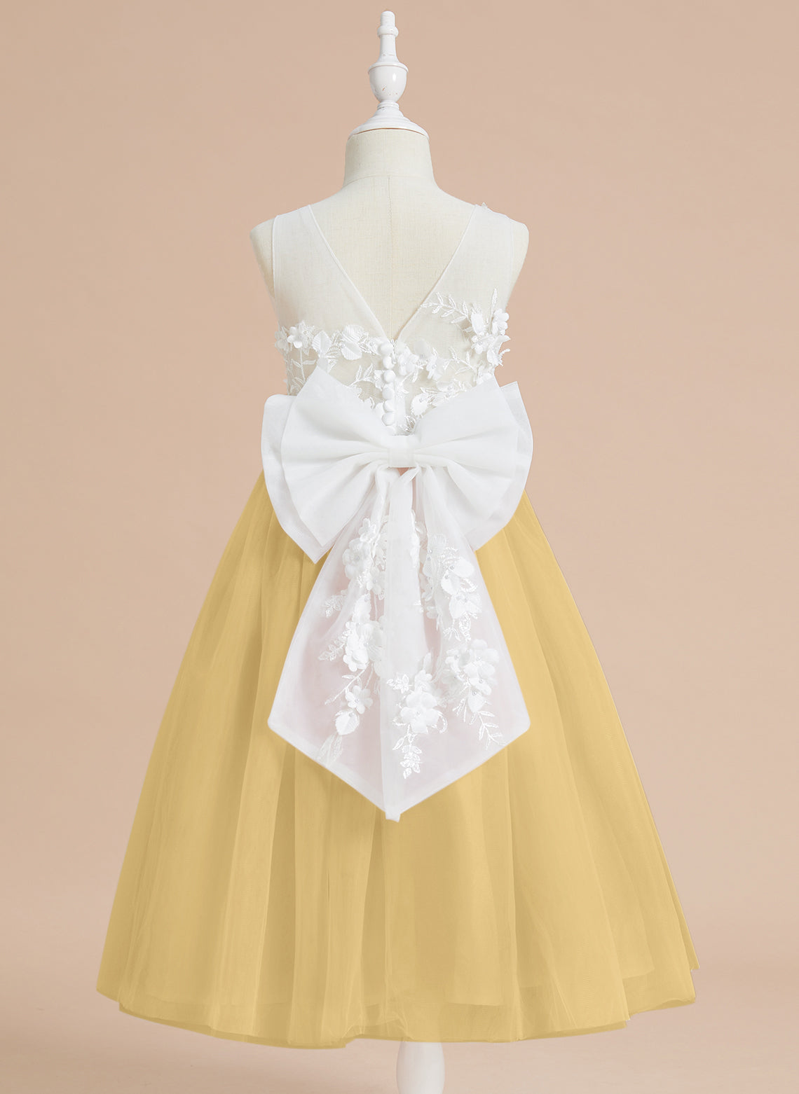 Vestido midi de encaje floral y lazo grande 