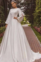 Magnifique robe de mariée blanche en satin, coupe trapèze, manches longues et appliques