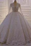 Magnifique robe de mariée blanche trapèze à col en V et manches longues en dentelle et sequins
